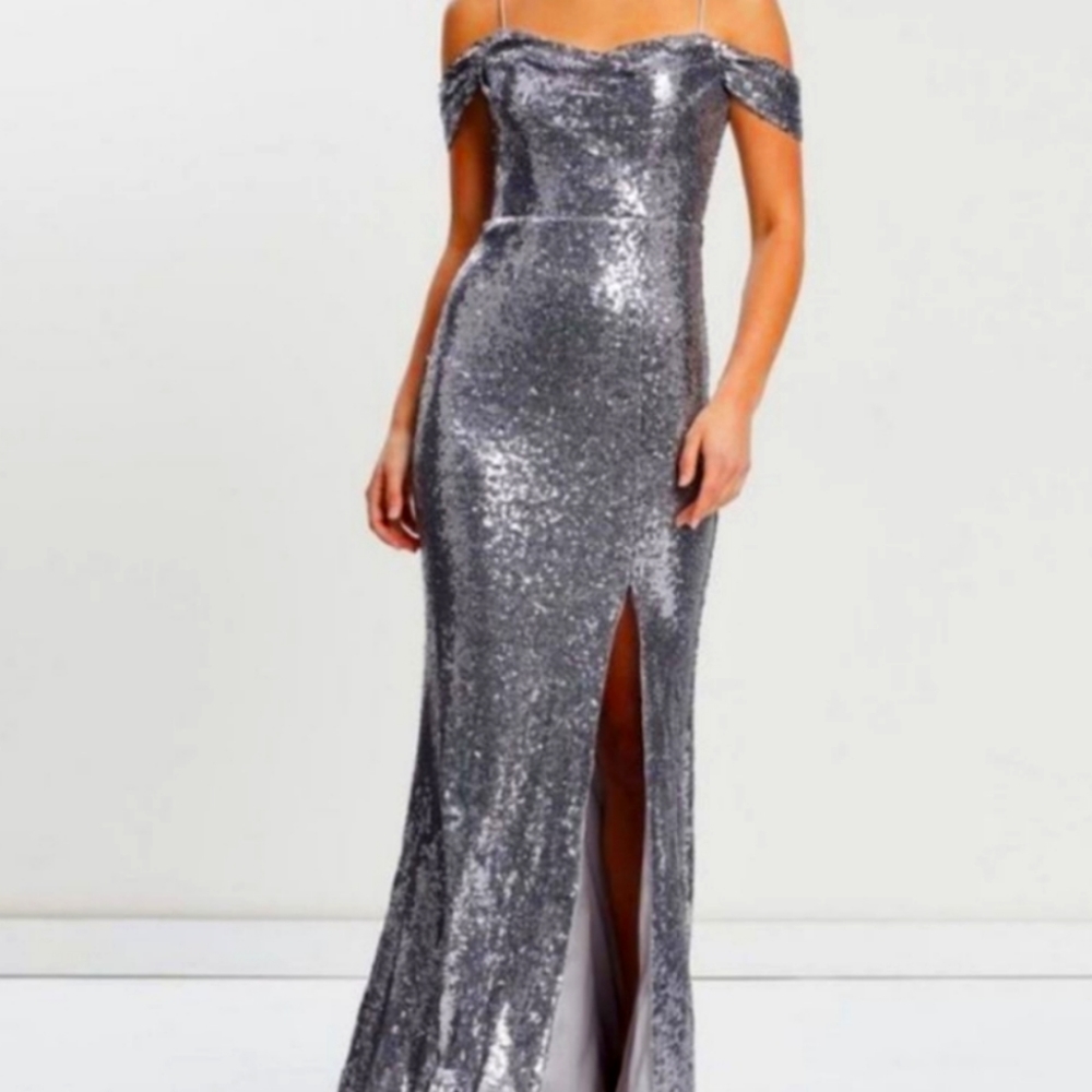 New with tags. Silver sequin corsette gown